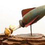 Christopher Abrams, "Retro rocket," 2013, basswood, brass. 3 (d) inches x 4 (h) inches (approx.) 