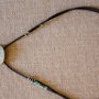 Lisa Heffley, Breastplate I, Adjustable & reversible necklace; bone, sterling silver, glass beads, leather. $500<br />